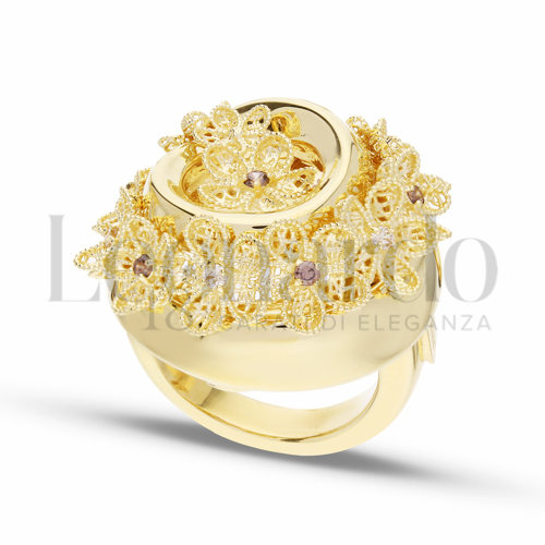 Modello Tondo con Zirconi bianchi e zirconi Brown in Oro Giallo da 7,6gr.