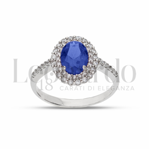 Contornato da due file di zirconi Modello con Pietra di Colore Blu e zirconi bianchi in Oro Bianco da 3,7gr.