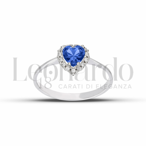 Contornato da una fila di zirconi Modello con Pietra di Colore Blu e zirconi bianchi in Oro Bianco da 1,9gr.