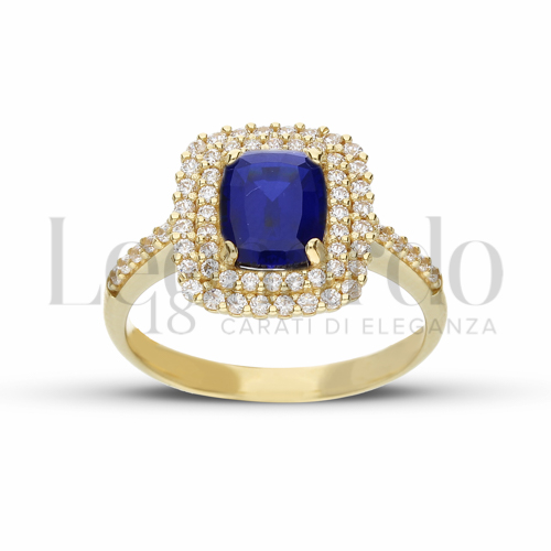Contornato da due file di zirconi Modello con Pietra di Colore Blu e zirconi bianchi in Oro Giallo da 4,2gr.