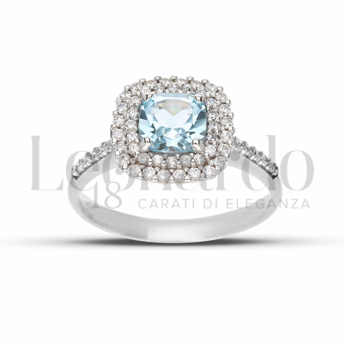 Contornato da due file di zirconi Modello con Topazio azzurro e zirconi bianchi in Oro Bianco da 3,8gr.