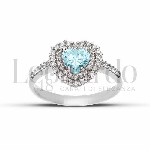 Contornato da due file di zirconi Modello con Topazio azzurro e zirconi bianchi in Oro Bianco da 3,7gr.