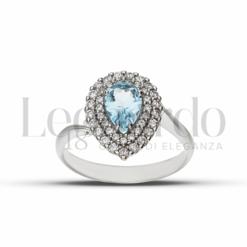 Contornato da due file di zirconi Modello con Topazio azzurro e zirconi bianchi in Oro Bianco da 3,2gr.