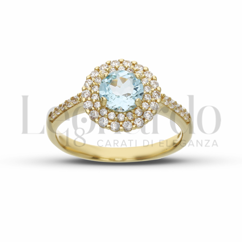 Contornato da due file di zirconi Modello con Topazio azzurro e zirconi bianchi in Oro Giallo da 3,6gr.