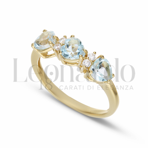 Trilogy Orizzontale Modello con Topazio azzurro e zirconi bianchi in Oro Giallo da 2,8gr.